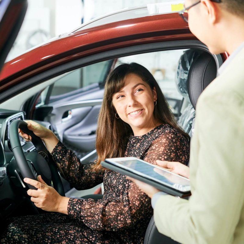 woman-and-salesman-in-car-showroom-1.jpg